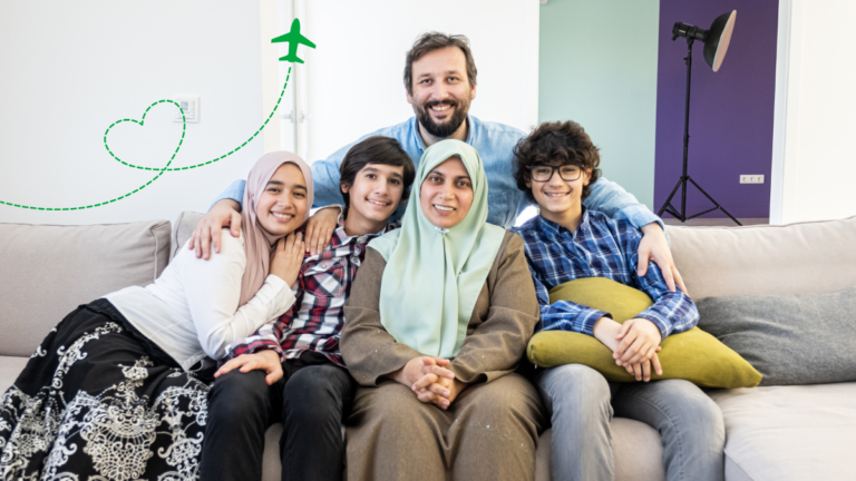 Happy family reunited in Saudi Arabia after receiving family visit visa - parents and children sitting together